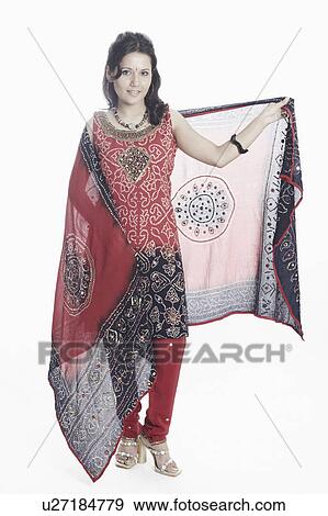 Portrait of a young woman with a stole in her hand posing View Large Photo Image Stock Photo - Portrait of a young woman with a stole in her hand posing. Fotosearch