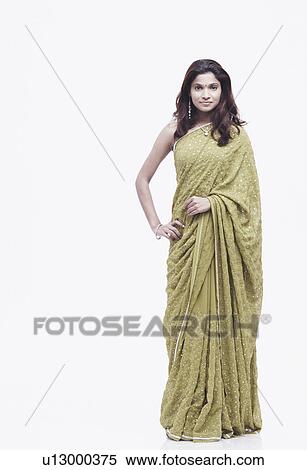Stock Photography - Portrait of a young woman with her hand on her hip. Fotosearch