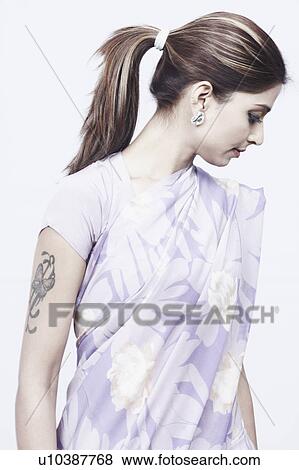 Stock Photo - Close-up of a young woman looking down. Fotosearch