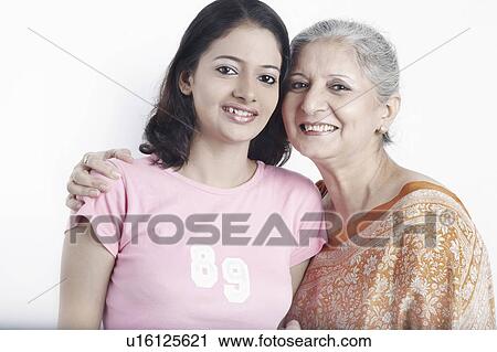 Portrait of a grandmother with her granddaughter View Large Photo Image Stock Image - Portrait of a grandmother with her granddaughter. Fotosearch