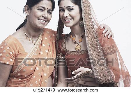Portrait of a mother and her daughter smiling View Large Photo Image Stock Photo - Portrait of a mother and her daughter smiling. Fotosearch