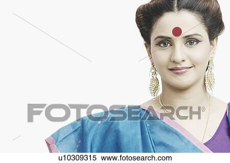 Stock Photography - Portrait of a young woman wearing a sari. Fotosearch