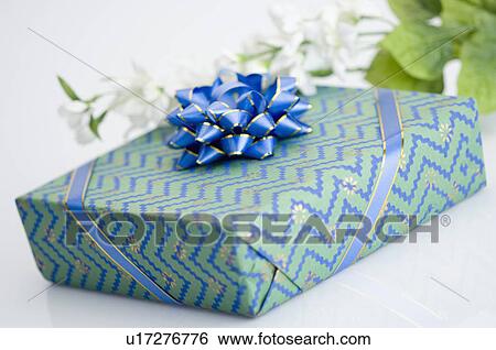 Stock Photograph - Close-up of a gift with flowers. Fotosearch