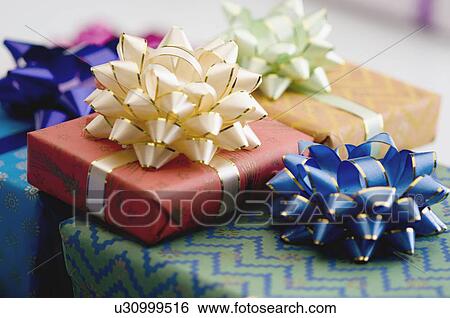 Stock Photograph - Close-up of a stack of gifts. Fotosearch
