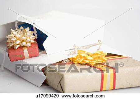 Close-up of gifts in two paper bags View Large Photo Image Stock Image - Close-up of gifts in two paper bags. Fotosearch