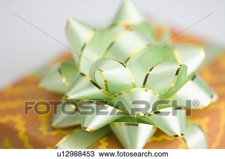 Stock Image - Close-up of the bow of a gift. Fotosearch