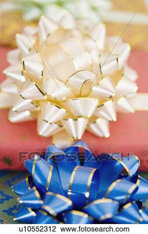 Close-up of the bows of three gifts View Large Photo Image Stock Image - Close-up of the bows of three gifts. Fotosearch