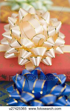 Close-up of the bows of three gifts View Large Photo Image Stock Photography - Close-up of the bows of three gifts. Fotosearch