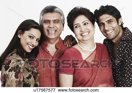 Close-up of a mature couple and their two children View Large Photo Image Stock Photo - Close-up of a mature couple and their two children. Fotosearch