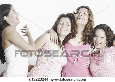 Picture - Close-up of four young women smiling. Fotosearch