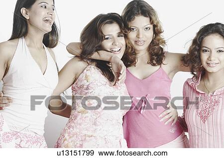 Stock Photo - Close-up of four young women smiling. Fotosearch
