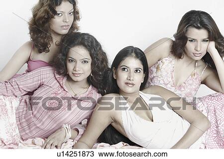 Stock Image - Close-up of four young women. Fotosearch