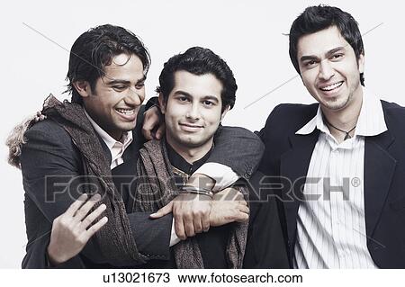 Close-up of three young men smiling View Large Photo Image Stock Image - Close-up of three young men smiling. Fotosearch