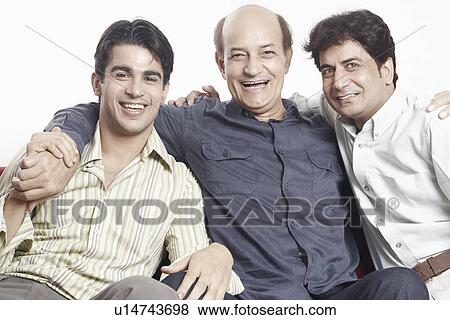 Portrait of a father sitting with his two sons View Large Photo Image Stock Photo - Portrait of a father sitting with his two sons. Fotosearch