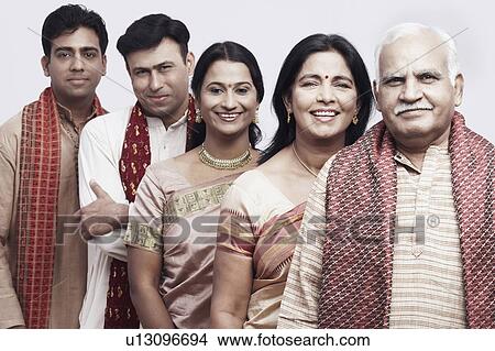Portrait of a mature couple and their children smiling View Large Photo Image Picture - Portrait of a mature couple and their children smiling. Fotosearch