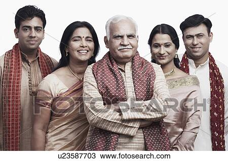 Portrait of a mature couple and their children smiling View Large Photo Image Stock Image - Portrait of a mature couple and their children smiling. Fotosearch