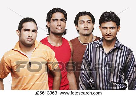 Stock Image - Portrait of four young men standing. Fotosearch