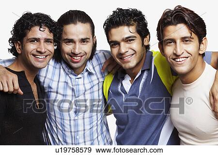 Stock Photo - Portrait of four young men standing with their arms around each other. Fotosearch