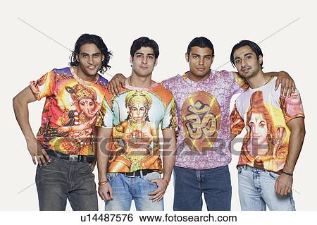 Stock Photograph - Portrait of four young men standing together and smiling. Fotosearch