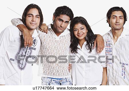 Picture - Portrait of three young men and a young woman standing side by side. Fotosearch