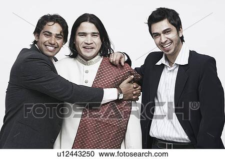 Portrait of three young men smiling View Large Photo Image Stock Image - Portrait of three young men smiling. Fotosearch