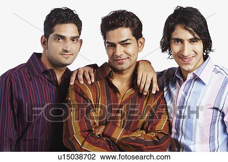 Stock Image - Portrait of three young men smiling. Fotosearch