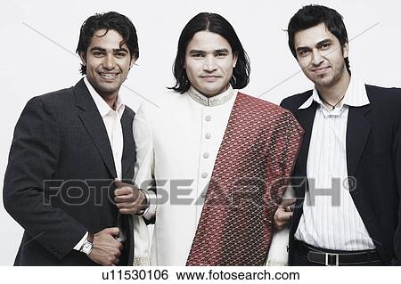 Stock Photograph - Portrait of three young men smiling. Fotosearch