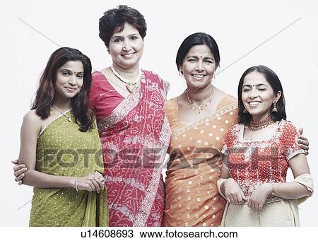 Stock Image - Portrait of two mothers standing with their daughters. Fotosearch