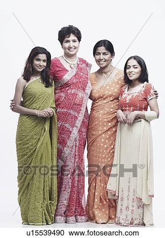 Stock Image - Portrait of two mothers standing with their daughters. Fotosearch