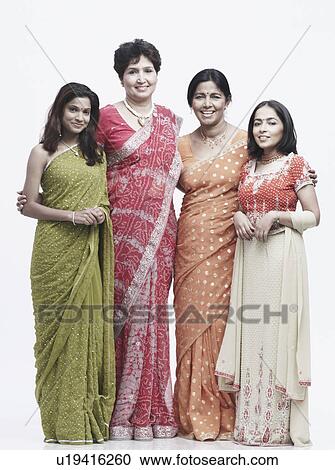 Stock Image - Portrait of two mothers standing with their daughters. Fotosearch