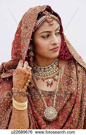 Close-up of a bride in a traditional wedding dress View Large Photo Image Stock Photograph - Close-up of a bride in a traditional wedding dress. Fotosearch