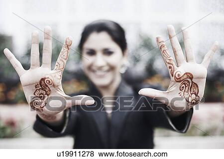Close-up of a henna tattoo on a young woman's hands View Large Photo Image Stock Photo - Close-up of a henna tattoo on a young woman's hands. Fotosearch