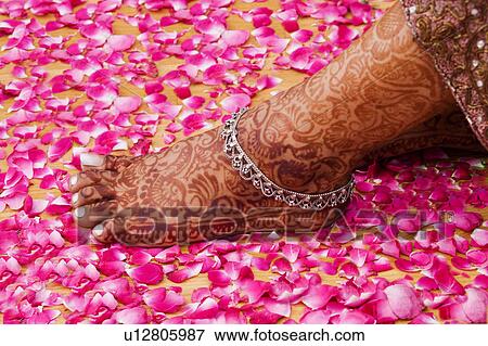Stock Photo - Close-up of a woman's henna tattooed leg. Fotosearch