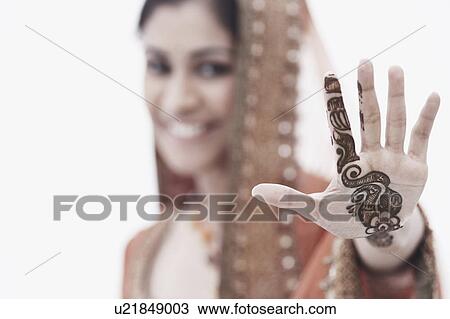 Close-up of a young woman with henna tattoo's on her hand View Large Photo Image Stock Image - Close-up of a young woman with henna tattoo's on her hand. Fotosearch
