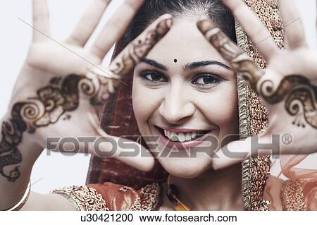 Close-up of a young woman with henna tattoo's on her hands View Large Photo Image Stock Image - Close-up of a young woman with henna tattoo's on her hands. Fotosearch