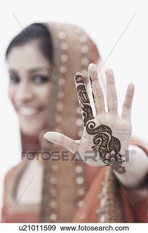 Close-up of a young woman with henna tattoo's on her hand View Large Photo Image Stock Photo - Close-up of a young woman with henna tattoo's on her hand. Fotosearch