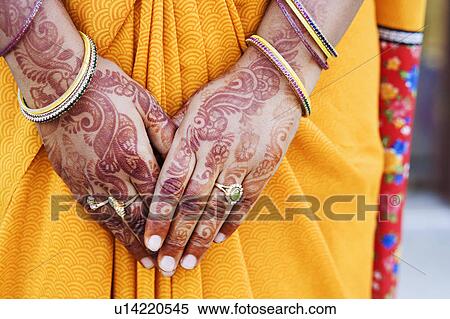Stock Photography - Henna tattoo on a woman's hands. Fotosearch