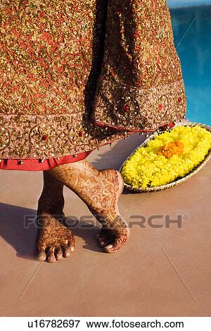 Low section view of a bride showing a henna tattoo on her feet View Large Photo Image Stock Photo - Low section view of a bride showing a henna tattoo on her feet. Fotosearch