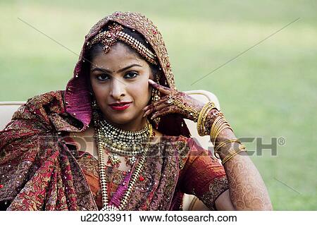 Stock Image - Portrait of a bride in a traditional wedding dress. Fotosearch
