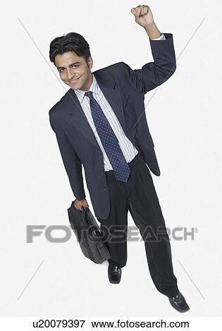 High angle view of a businessman smiling View Large Photo Image Stock Photo - High angle view of a businessman smiling. Fotosearch