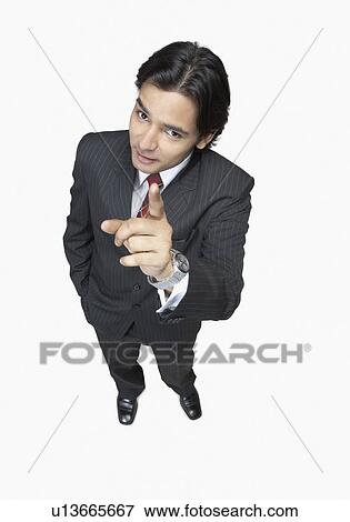 High angle view of a businessman pointing up View Large Photo Image Stock Photo - High angle view of a businessman pointing up. Fotosearch