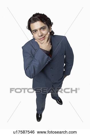 High angle view of a businessman with his hand on his chin View Large Photo Image Stock Photograph - High angle view of a businessman with his hand on his chin. Fotosearch