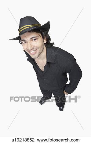 Stock Image - High angle view of a young man smiling. Fotosearch