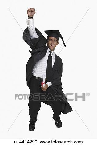 Portrait of a young man holding a diploma and smiling View Large Photo Image Stock Image - Portrait of a young man holding a diploma and smiling. Fotosearch