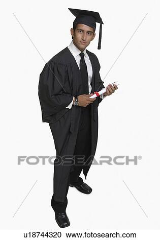 Stock Image - Portrait of a young man holding a diploma. Fotosearch