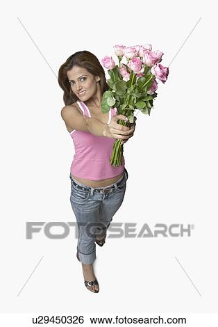 Stock Photograph - Portrait of a young woman holding a bunch of flowers. Fotosearch