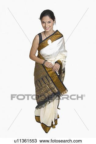 Stock Image - Portrait of a young woman wearing sari. Fotosearch