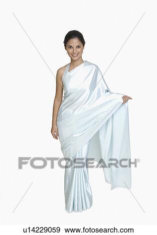 Portrait of a young woman wearing sari View Large Photo Image Stock Photo - Portrait of a young woman wearing sari. Fotosearch