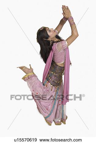 Side profile of a young woman dancing View Large Photo Image Stock Photo - Side profile of a young woman dancing. Fotosearch