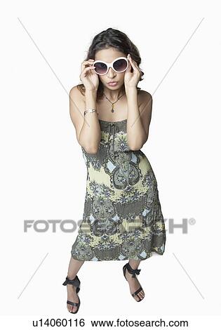 Young woman wearing sunglasses View Large Photo Image Stock Photograph - Young woman wearing sunglasses. Fotosearch